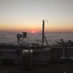 Rooftop Maïdo observatory above cloud deck during sunset